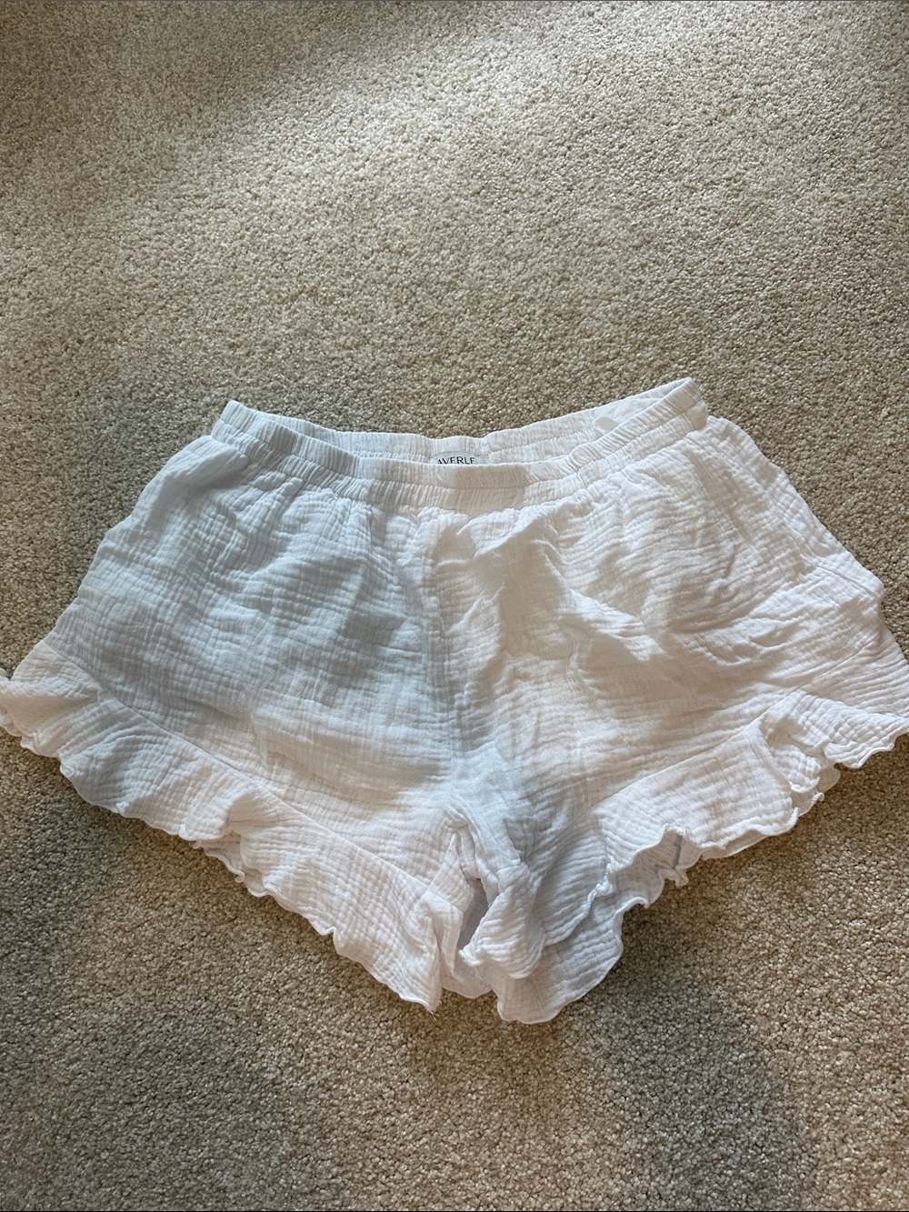 Vaverle White Textured Ruffle Hem Shorts